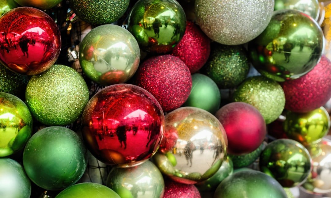 2025 nail trends featuring red and green Christmas nails with matte, chrome, and rhinestone designs