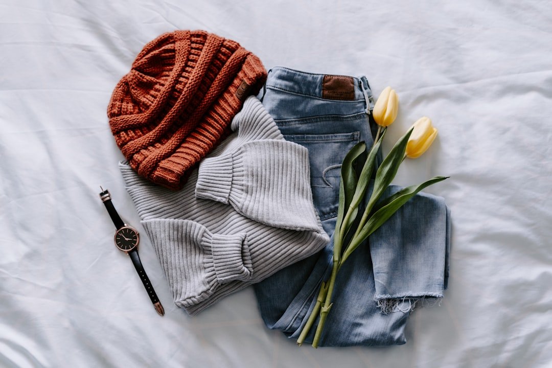 Chunky knit sweater, jeans, and boots styled as casual fall outfits for a chic look.