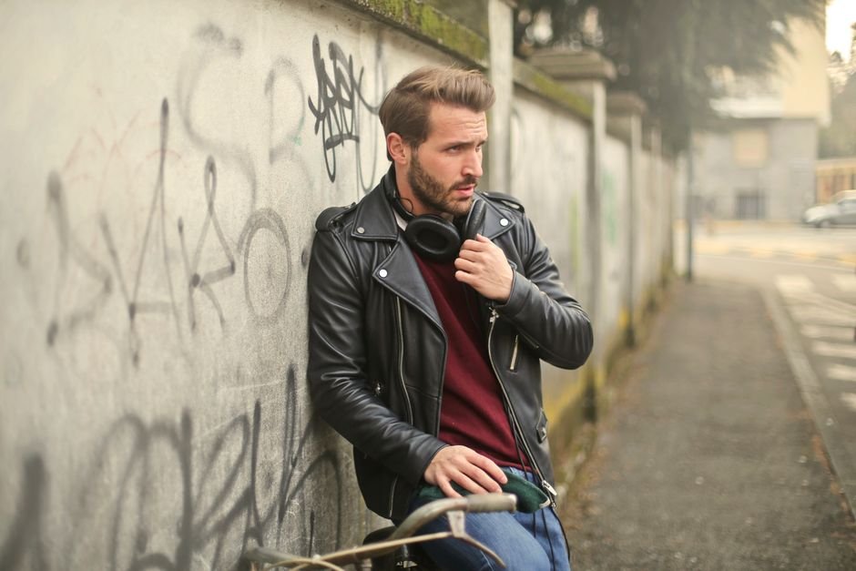 Men and women wearing leather jacket outfits in different cuts—biker, bomber, cropped—styled to flatter their unique body types