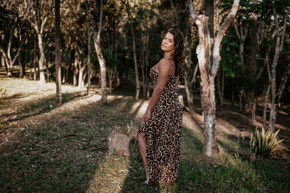 Leopard print outfit styled with white, emerald green, and red accents for complementary summer color combinations