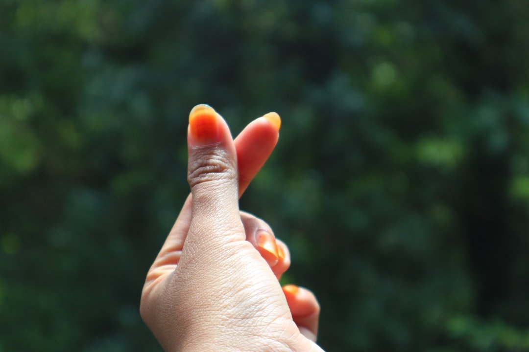 Creative orange nail art with sunset gradients, citrus fruit designs, and geometric patterns