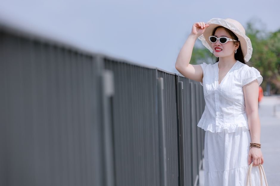 Different body types styled in white summer dresses including A-line, wrap, maxi, and shift designs.