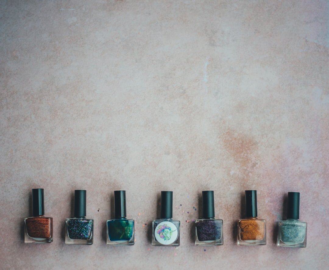 Collage of fall nail trends for different occasions—neutral brown office nails, plaid sweater nails, and metallic party nails