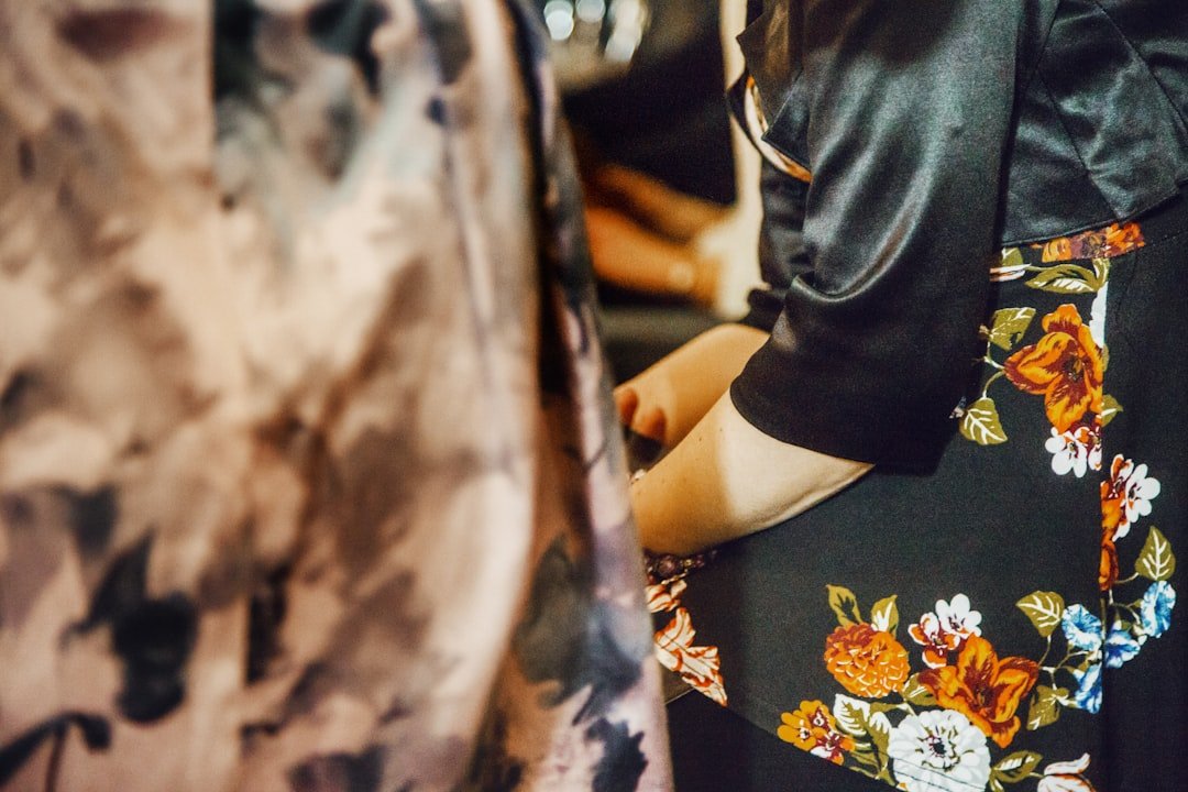 Pastel, vibrant, and classic-tone floral prom dresses displayed together, showcasing diverse color schemes