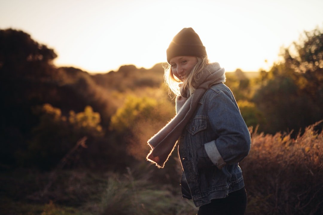 Denim Fall Outfits: Complete Guide to Styling Jeans for Autumn 2025 2 Layered denim fall outfit with denim shirt, trench coat, and jeans for autumn weather.