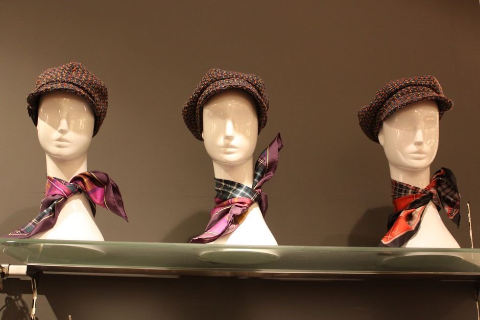 Silk scarf styled in the effortless loop and cravat twist neck techniques