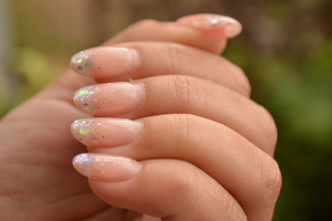 Comparison of almond shape fall manicure in nail salon versus at-home DIY fall nail setup