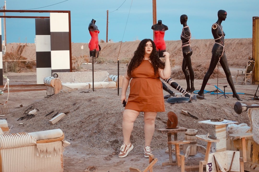 Plus-size woman in a wrap dress showing stylish curvy outfit ideas for every body figure