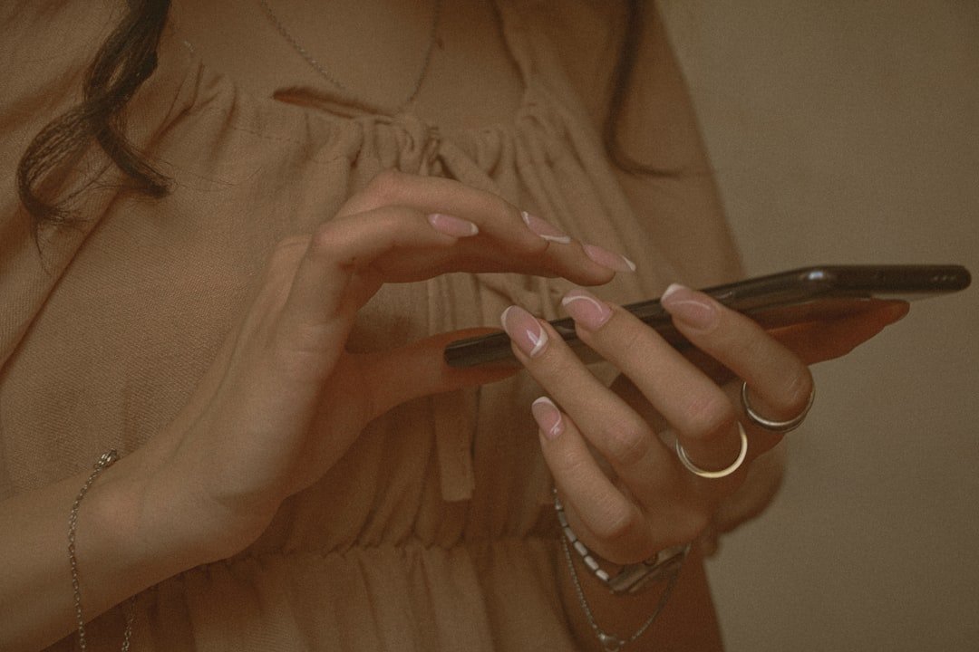Brown Nails: 50+ Chic Designs to Try for 2025’s Top Trend 5 Brown nails styled with fashion accessories including gold rings, a leather handbag, and neutral chic clothing