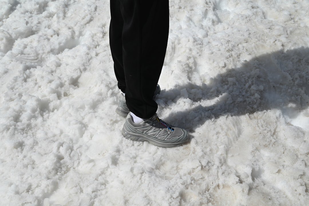 Comparison of winter sweatpants outfits showing a sloppy oversized look versus a chic tailored joggers and coat style