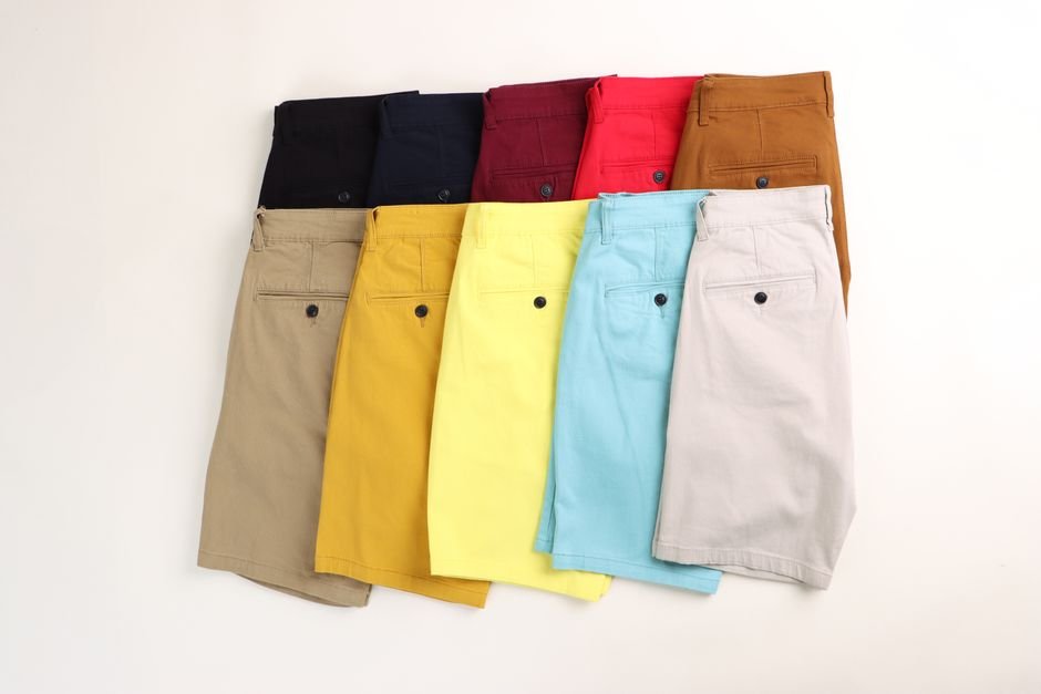 Color palette of Bermuda shorts outfits including black-and-white, pastel, denim, and bold summer prints with styled accessories