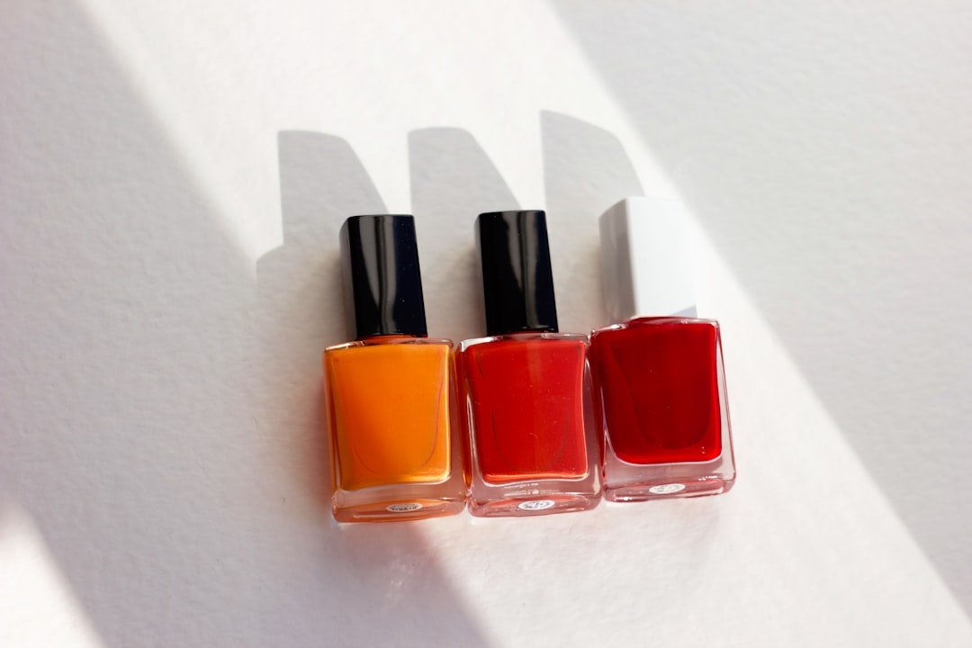 Collage of trending square fall nails in autumn colors and patterns.