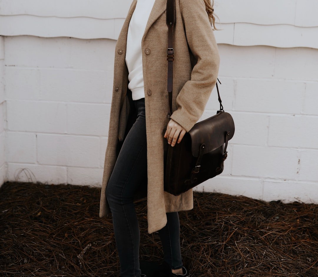 Student in blazer, plaid skirt, and loafers showcasing Light Academia outfits for school or work.