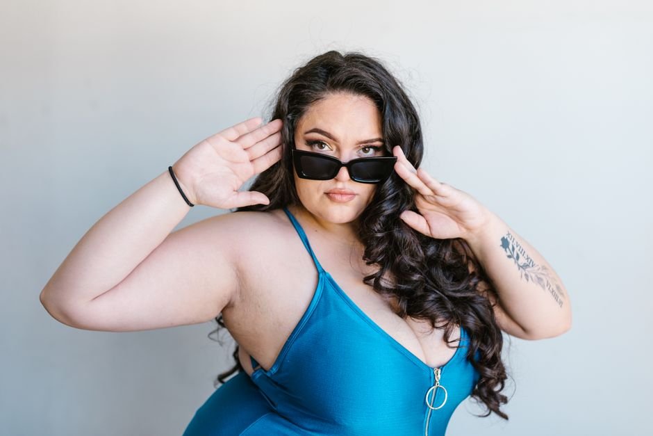 Happy plus size shopper exploring summer dress options from popular fashion brands