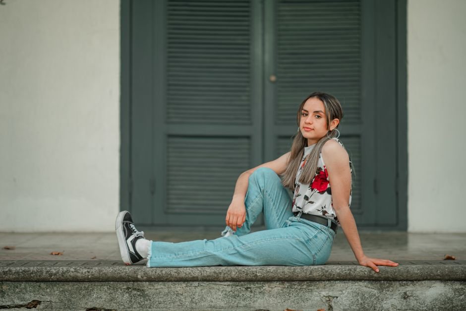 Three wide leg jeans outfit ideas: professional dark wash denim with blazer, casual jeans with sneakers, and evening style with silk cami and heels