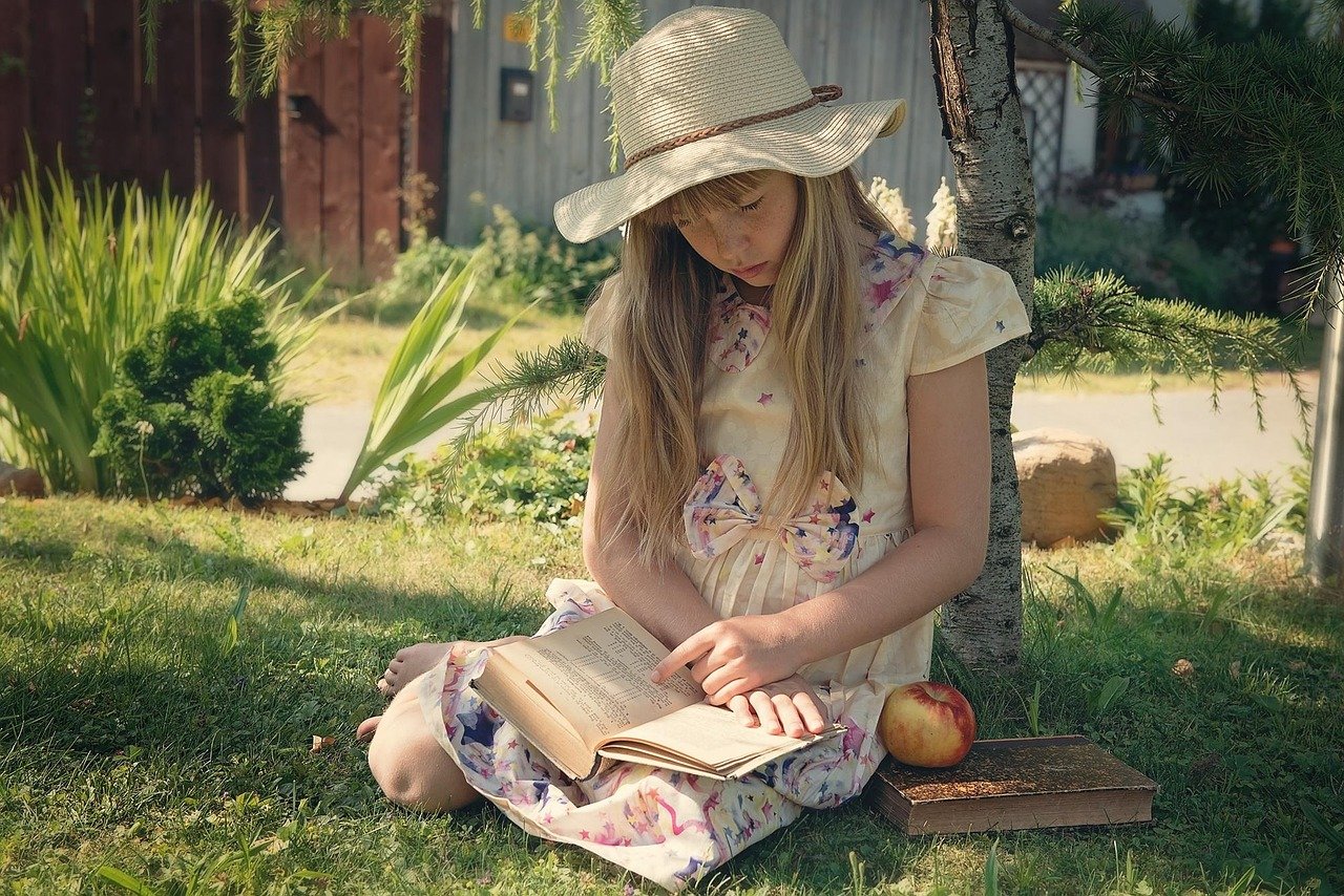 Long hair under a cowboy hat