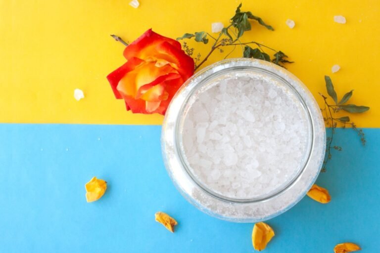 Woman exfoliating with sugar on a spa day, benefiting from sugar exfoliating for glowing skin