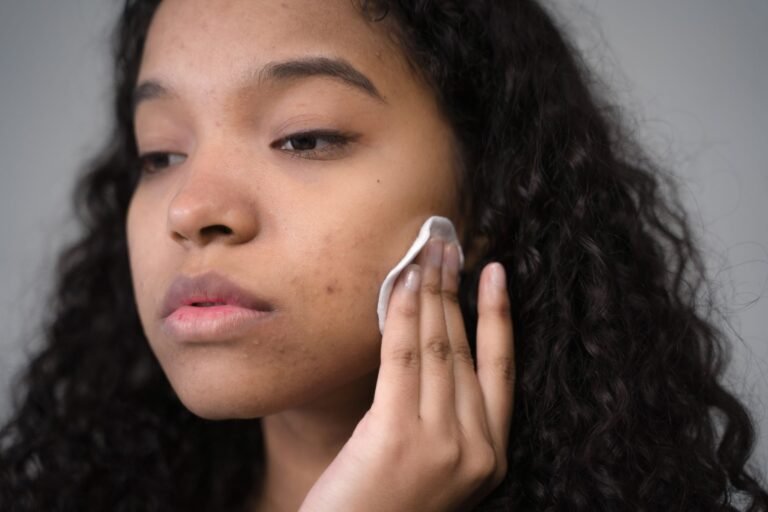 Woman removing dark spots with effective skincare remedies, dark spots removal