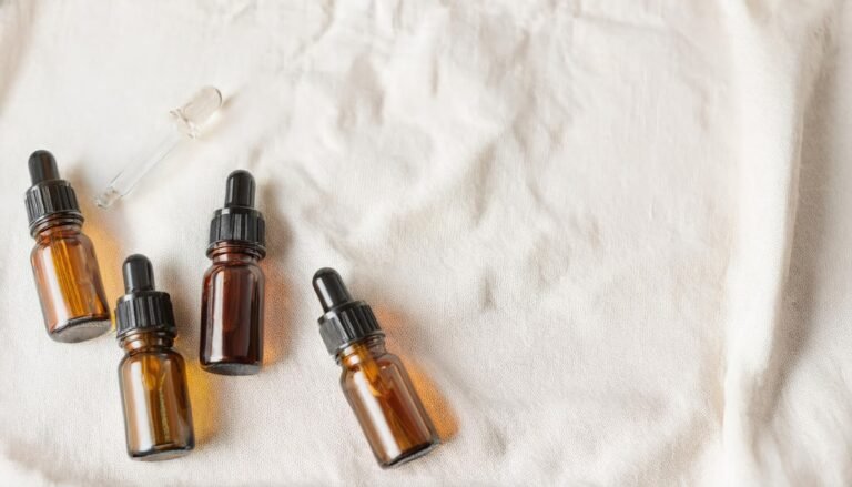 Woman applying essential oils for skin, natural skincare solutions, essential oils benefits