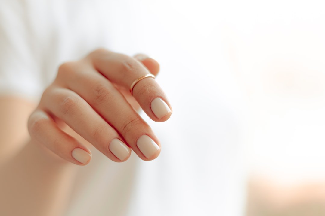 Gel nail lifting due to moisture causing splits and damage